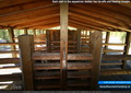 Each stall in the equestrian shelter has tie-offs and feeding troughs